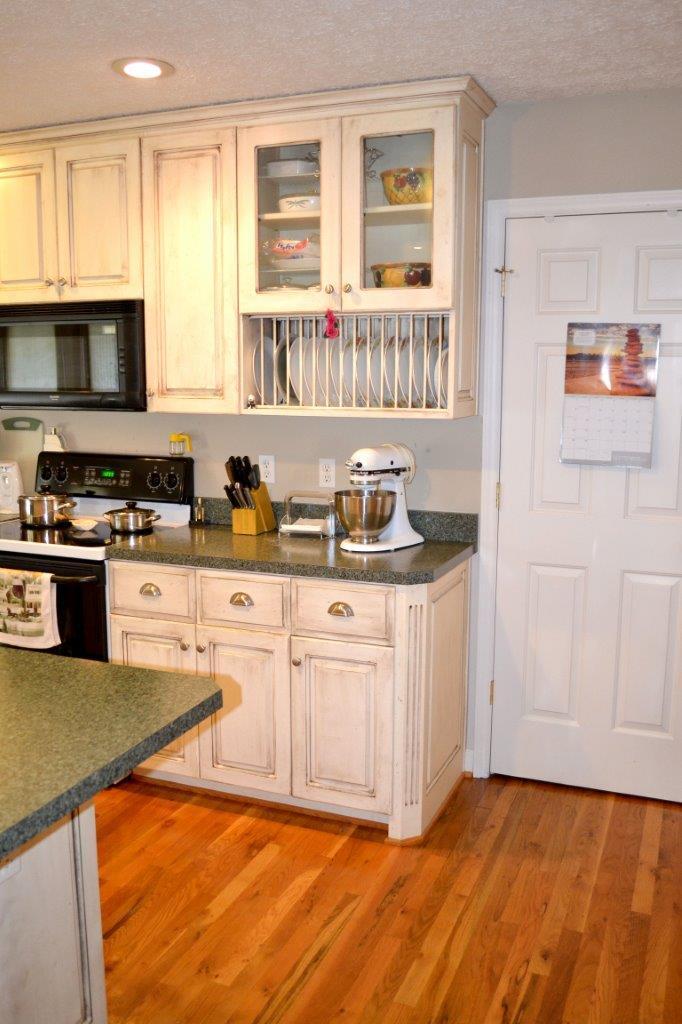 2588 Iron Ridge Road Rocky Mount, VA 24151 - Photo 28 of 65 a kitchen with stainless steel appliances granite countertop a stove a sink and a microwave
