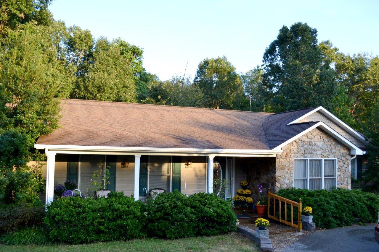 2588 Iron Ridge Road Rocky Mount, VA 24151 - Photo 4 of 65 a view of house with garden and tall trees
