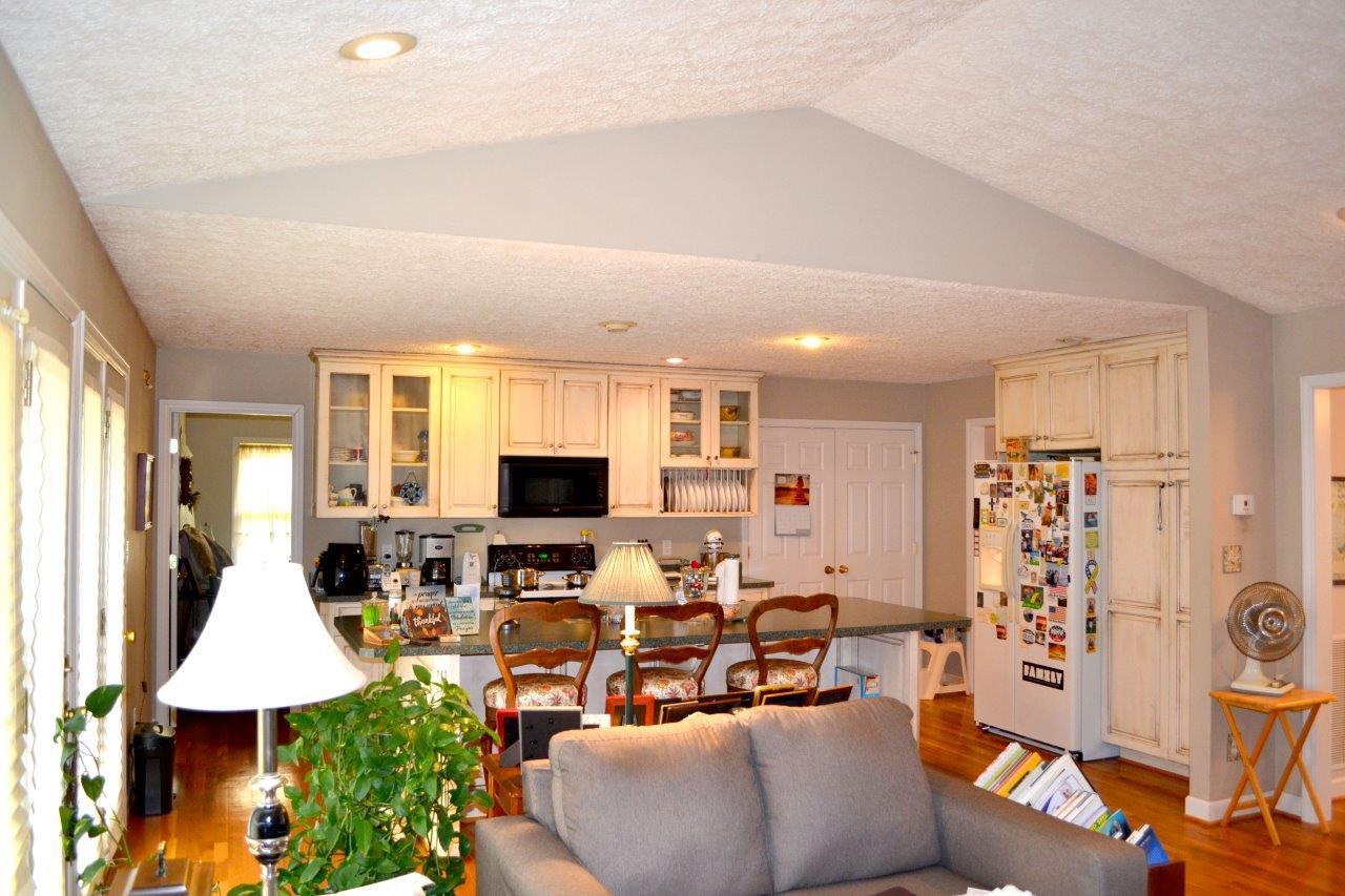 2588 Iron Ridge Road Rocky Mount, VA 24151 - Photo 39 of 65 a living room with furniture a flat screen tv and a window
