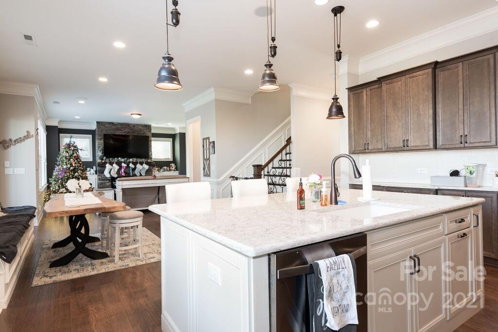 5232 Meadowcroft Way Fort Mill, SC 29708 - Photo 14 of 44 a kitchen with stainless steel appliances granite countertop a sink a stove and a table