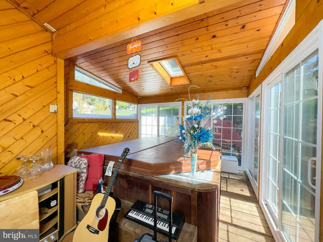 a view of a patio with a table and chairs