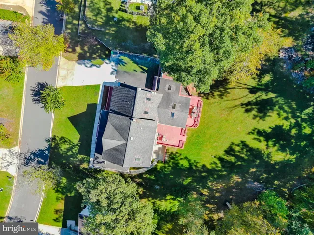 an aerial view of a house with an outdoor space