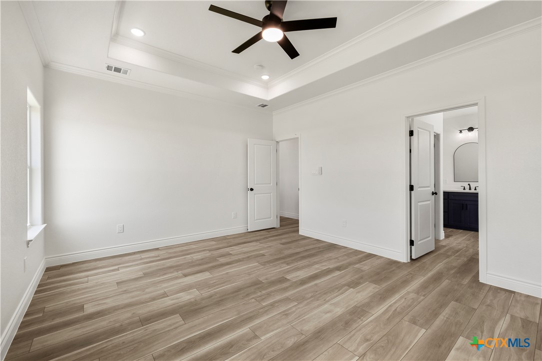 1823 Ember Drive Temple, TX 76502 - Photo 18 of 46 a view of empty room with wooden floor