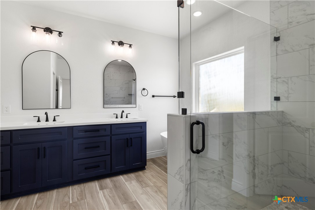 1823 Ember Drive Temple, TX 76502 - Photo 21 of 46 a bathroom with a double vanity sink double and mirror