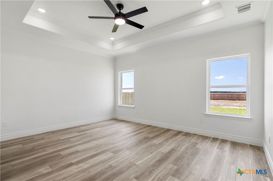 1823 Ember Drive Temple, TX 76502 - Photo 24 of 46 wooden floor in an empty room with a window