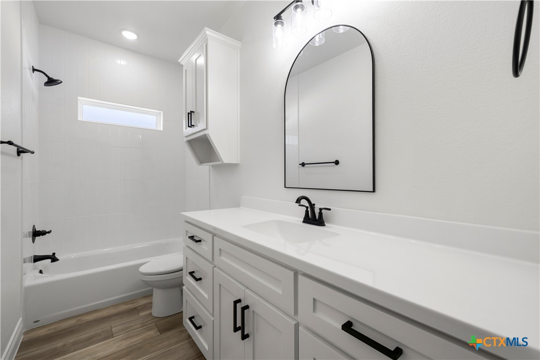 1823 Ember Drive Temple, TX 76502 - Photo 27 of 46 a bathroom with a sink a toilet and a bathtub