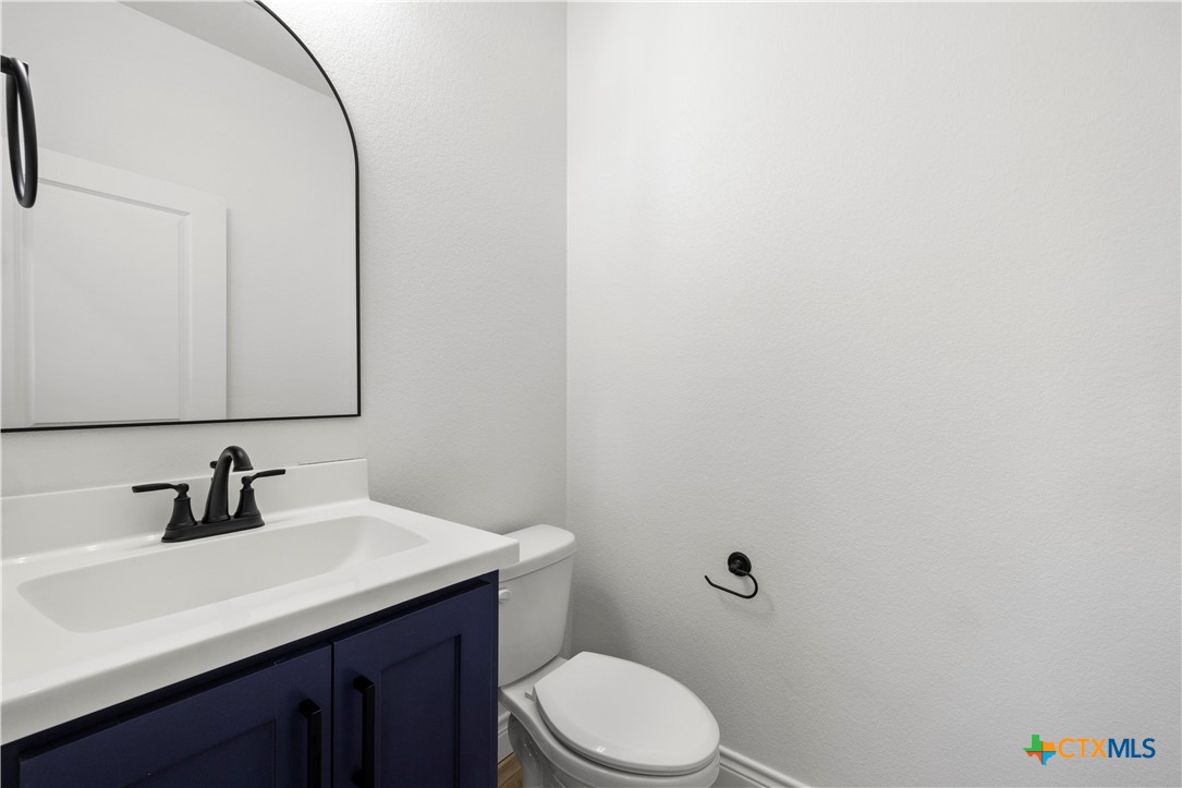 1823 Ember Drive Temple, TX 76502 - Photo 31 of 46 a bathroom with a sink a toilet and mirror