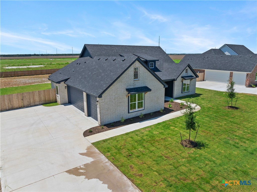 1823 Ember Drive Temple, TX 76502 - Photo 38 of 46 a house with green field in front of it