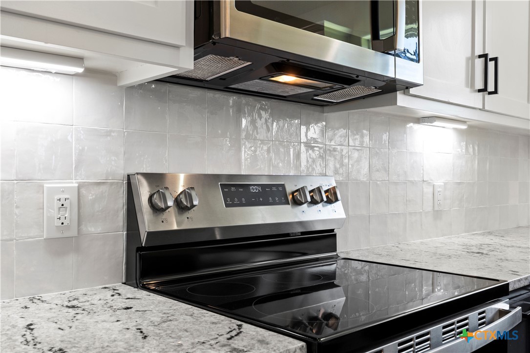 1823 Ember Drive Temple, TX 76502 - Photo 9 of 46 a stove top oven sitting inside of a kitchen