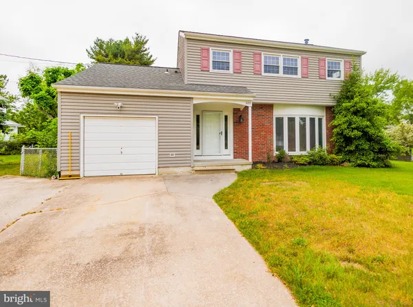 front view of house next to a yard