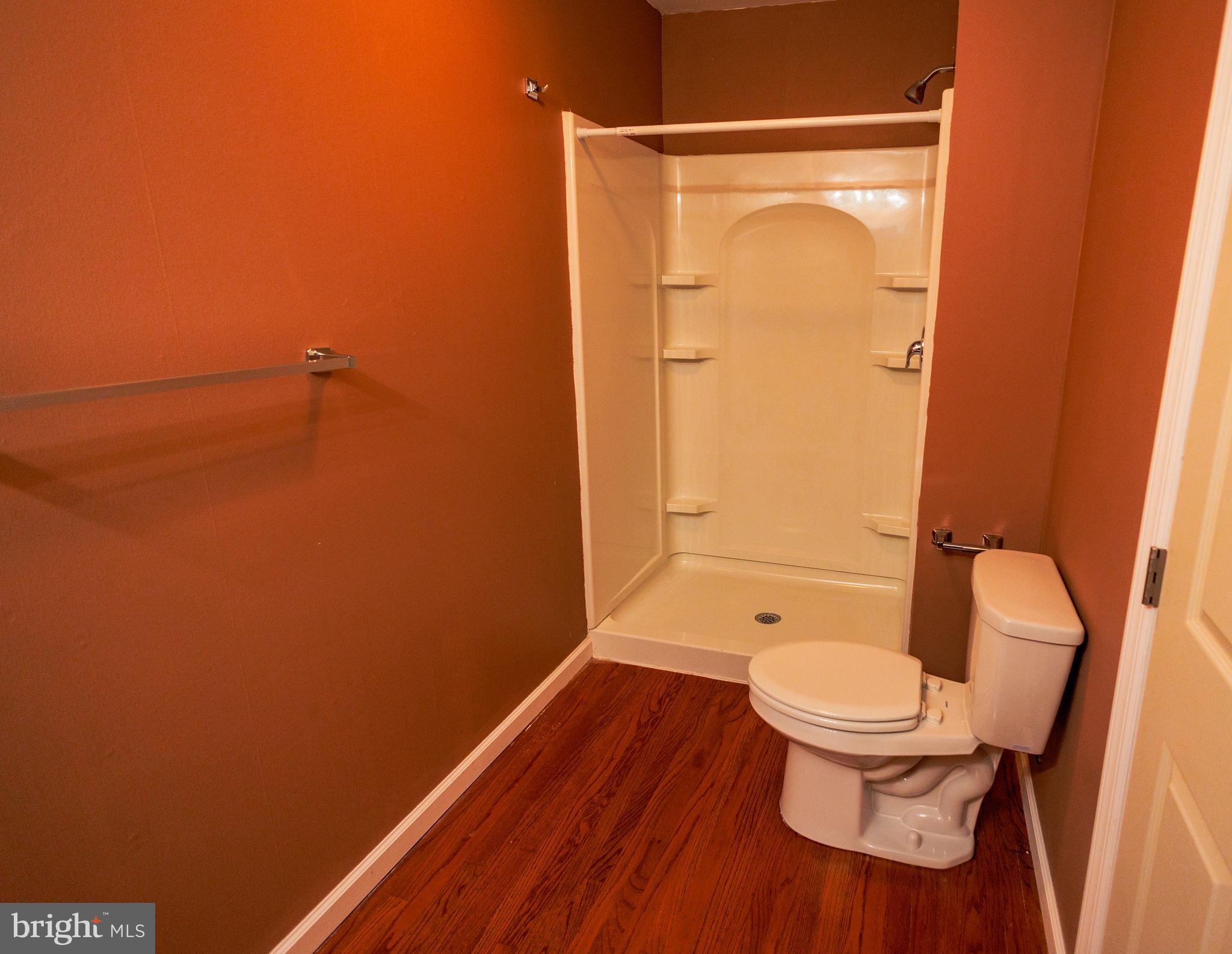 300 Macclelland Avenue Glassboro, NJ 08028 - Photo 12 of 39 a bathroom with a toilet and a shower