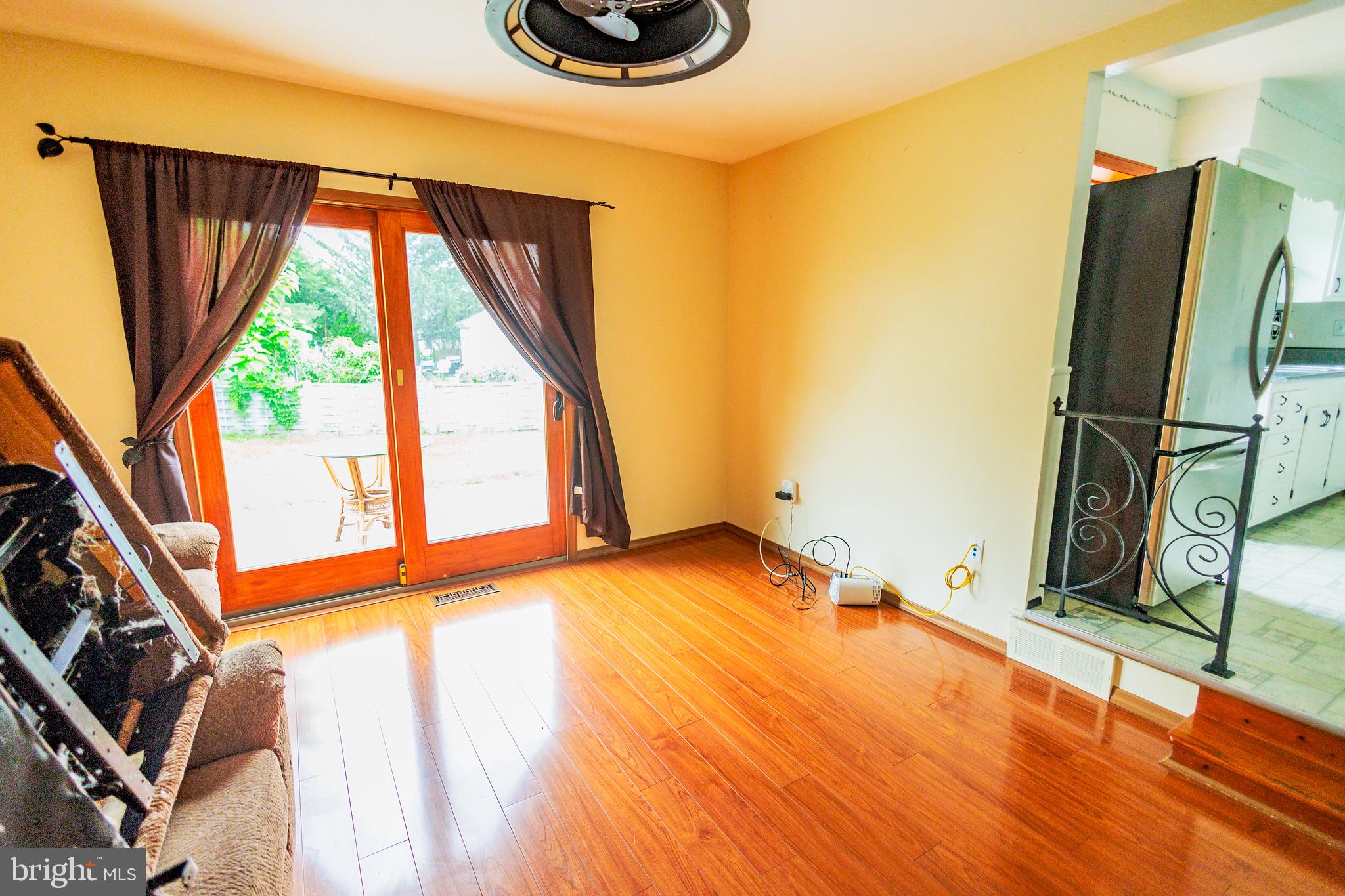 300 Macclelland Avenue Glassboro, NJ 08028 - Photo 19 of 39 a view of a room with wooden floor and iron stairs