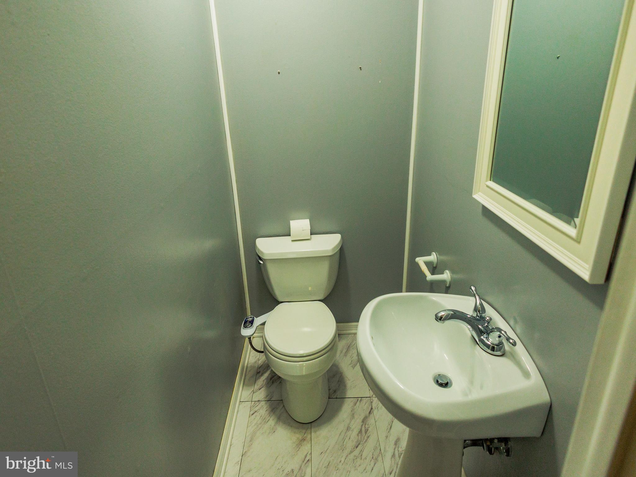 300 Macclelland Avenue Glassboro, NJ 08028 - Photo 20 of 39 a bathroom with a sink and a toilet