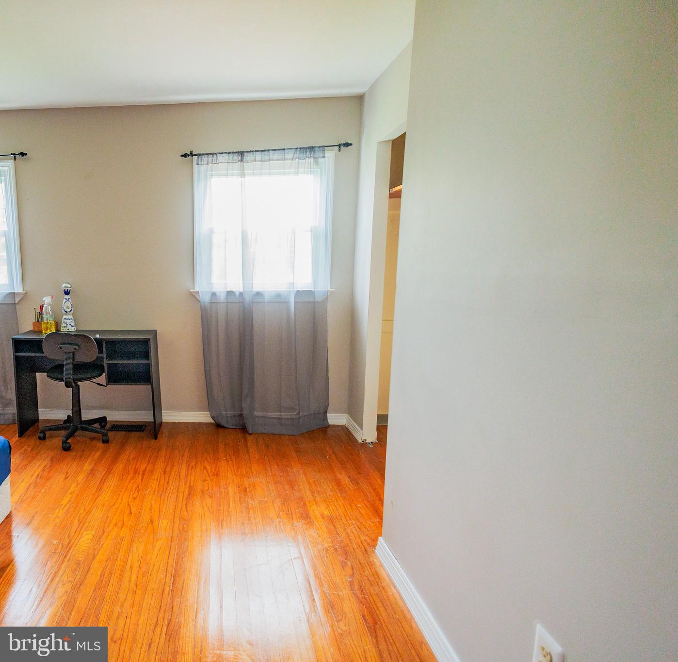 300 Macclelland Avenue Glassboro, NJ 08028 - Photo 23 of 39 a view of an empty room with wooden floor and a window
