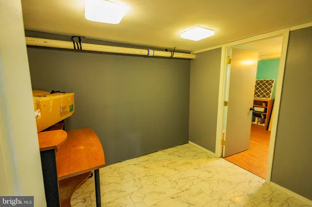 a bathroom with a sink mirror vanity and toilet