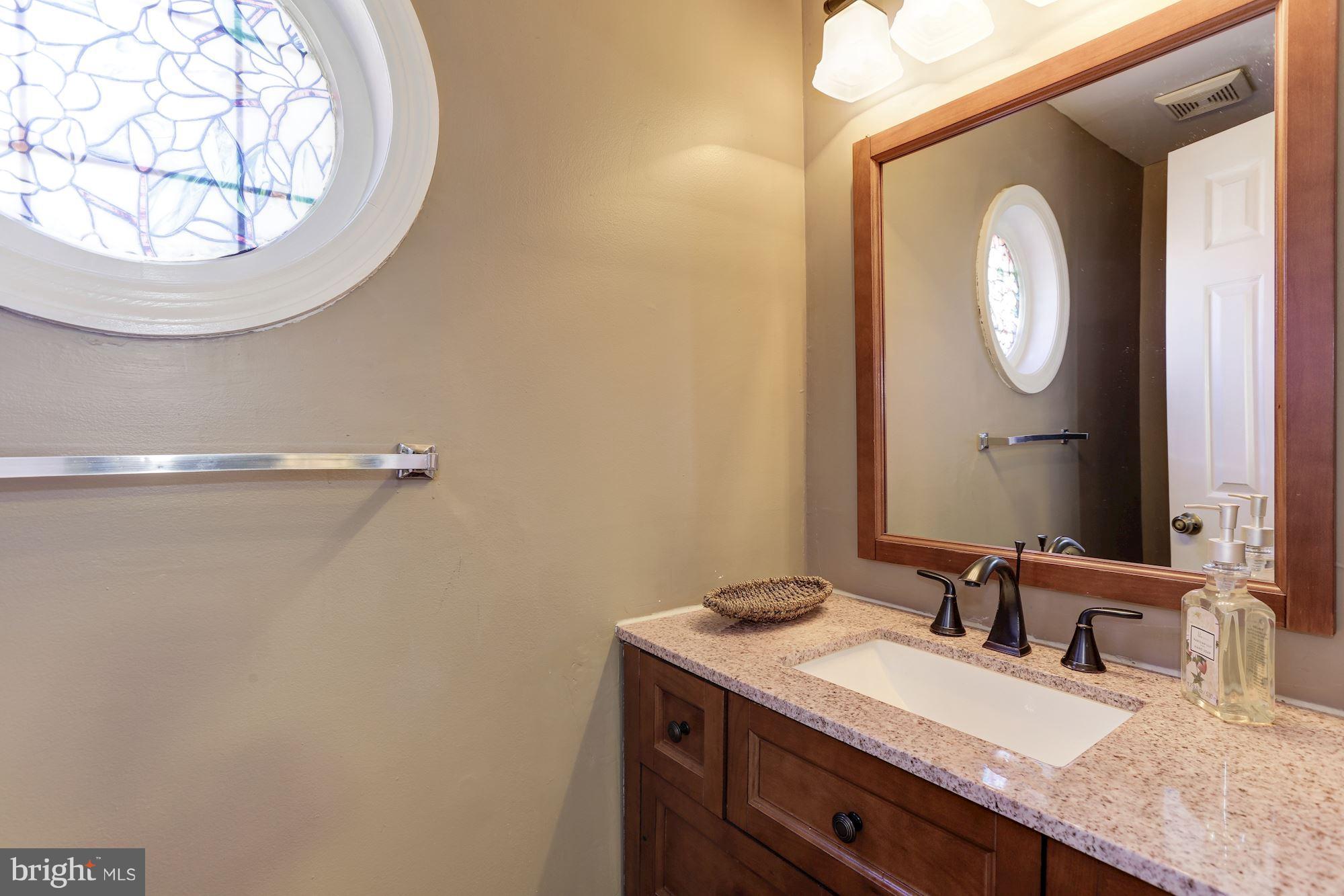 9432 Trevino Terrace, Unit 76 Laurel, MD 20708 - Photo 7 of 30 Half bath at entrance w/ beautiful stained glass