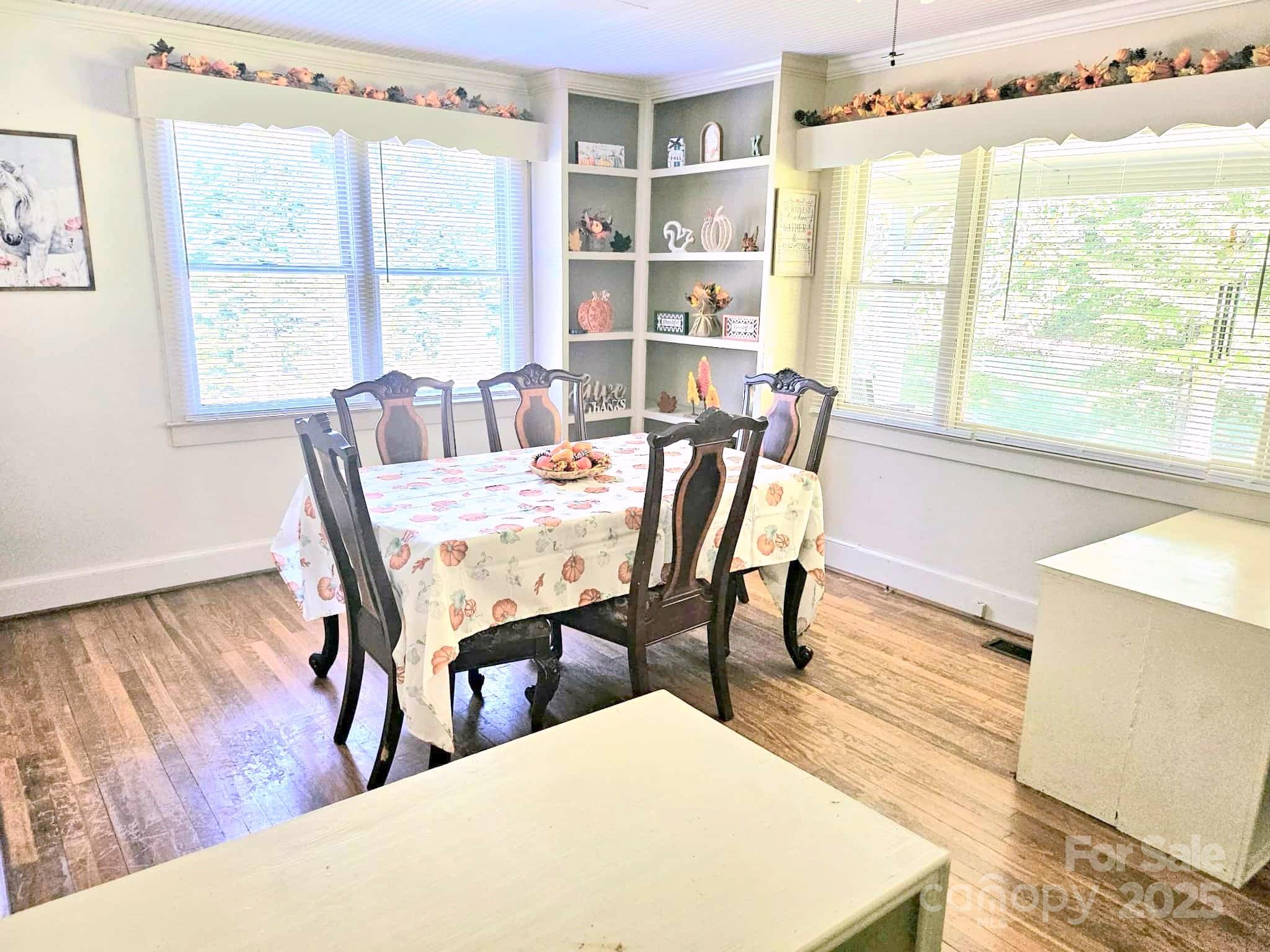3744 Hunting Country Road Tryon, NC 28782 - Photo 11 of 34 a view of a dining room with furniture and wooden floor