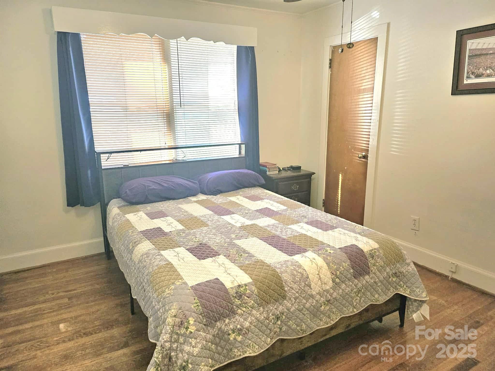 3744 Hunting Country Road Tryon, NC 28782 - Photo 15 of 34 a bedroom with a bed and a window