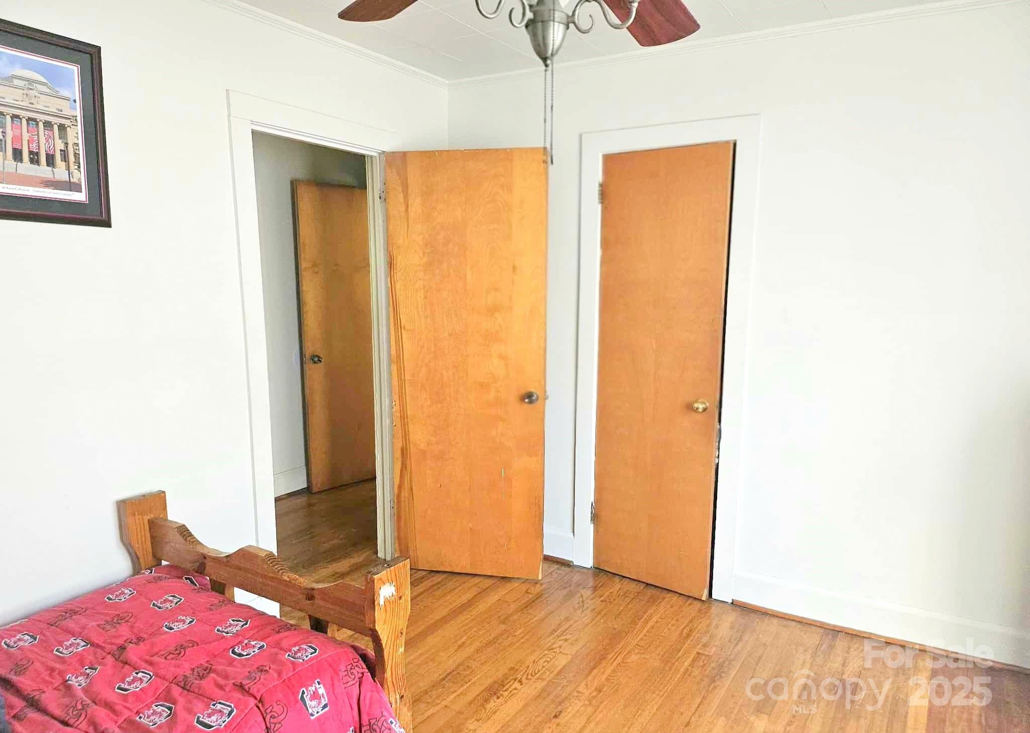 3744 Hunting Country Road Tryon, NC 28782 - Photo 19 of 34 a bedroom with a bed and wooden floor
