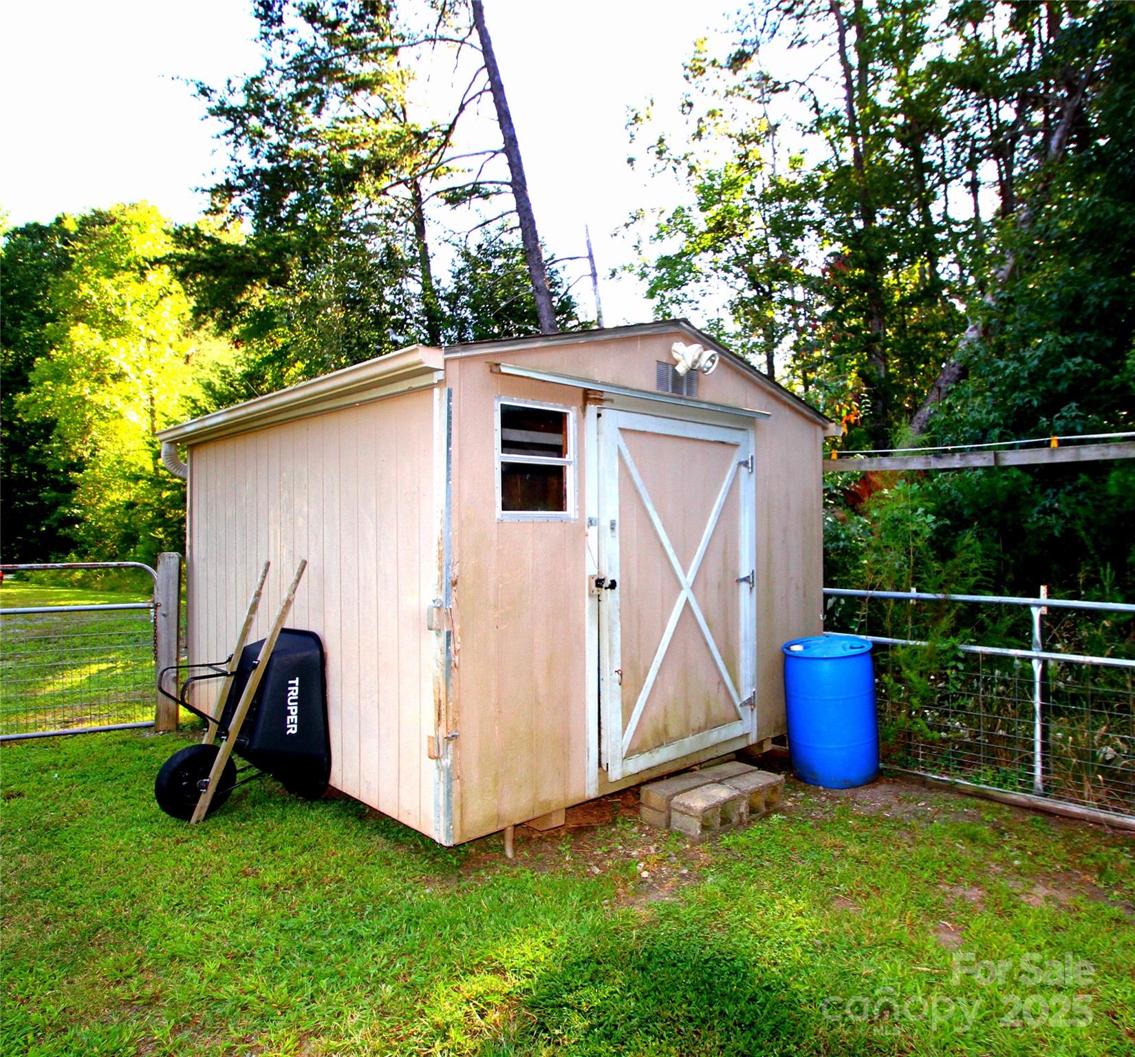 3744 Hunting Country Road Tryon, NC 28782 - Photo 21 of 34 a backyard of a house with table and chairs