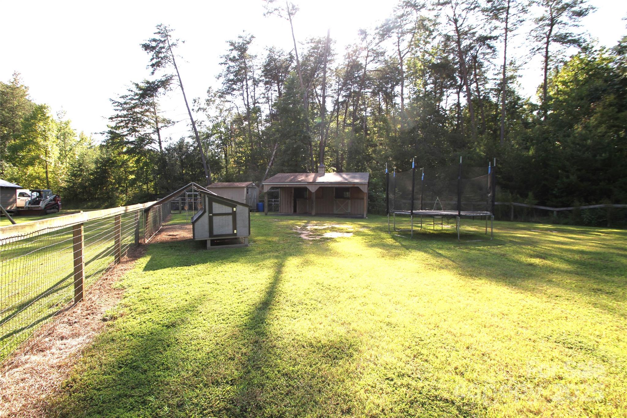 3744 Hunting Country Road Tryon, NC 28782 - Photo 27 of 34 a view of a swimming pool with a patio and yard