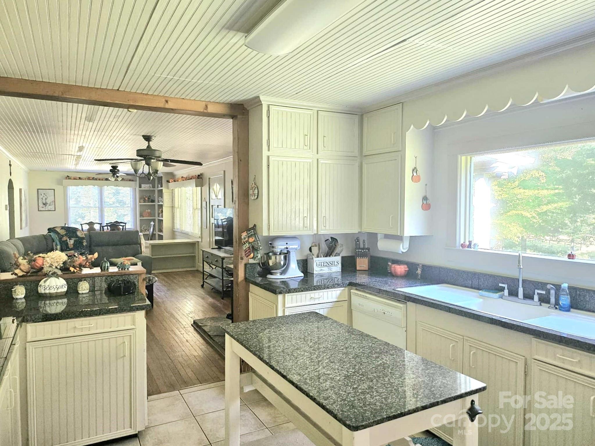 3744 Hunting Country Road Tryon, NC 28782 - Photo 7 of 34 a kitchen with counter top space and living room