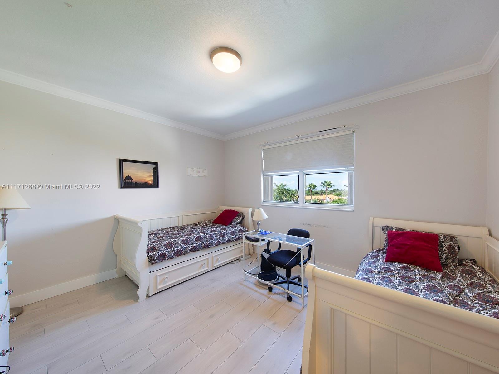 735 Crandon Boulevard, Unit 503 Key Biscayne, FL 33149 - Photo 16 of 18 a living room with furniture and a window