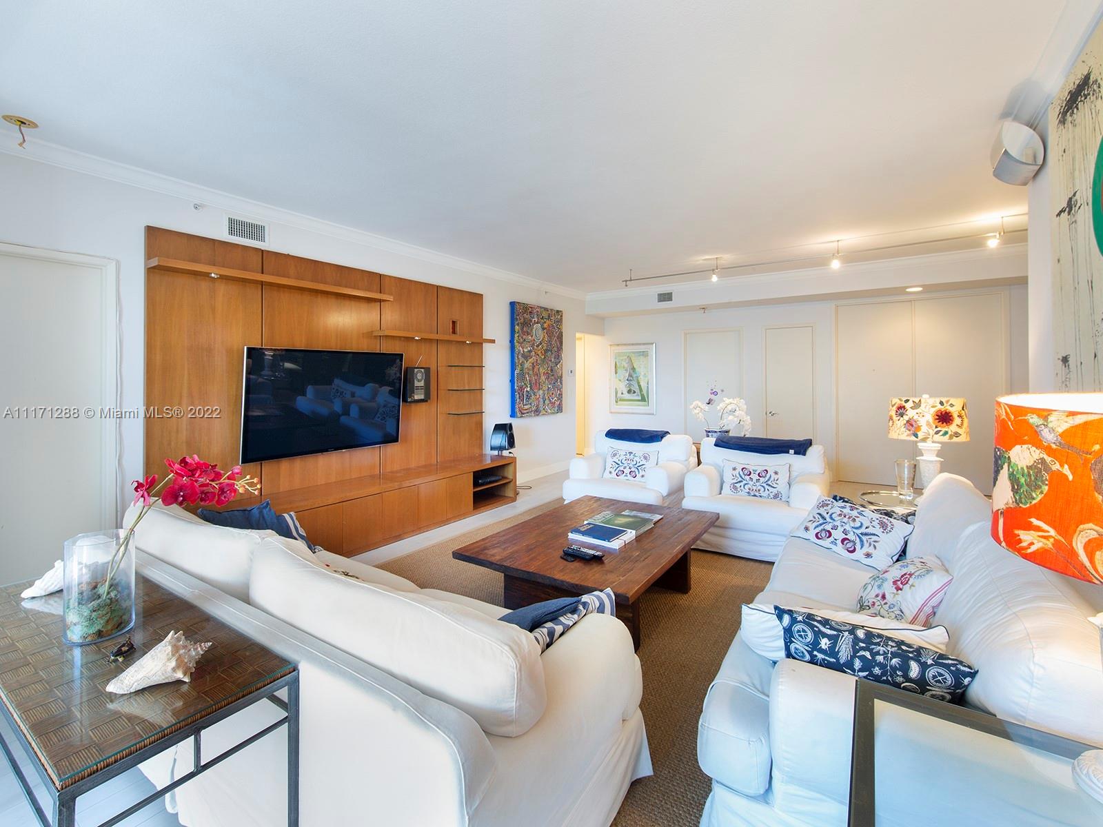 735 Crandon Boulevard, Unit 503 Key Biscayne, FL 33149 - Photo 4 of 18 a living room with furniture and wooden floor