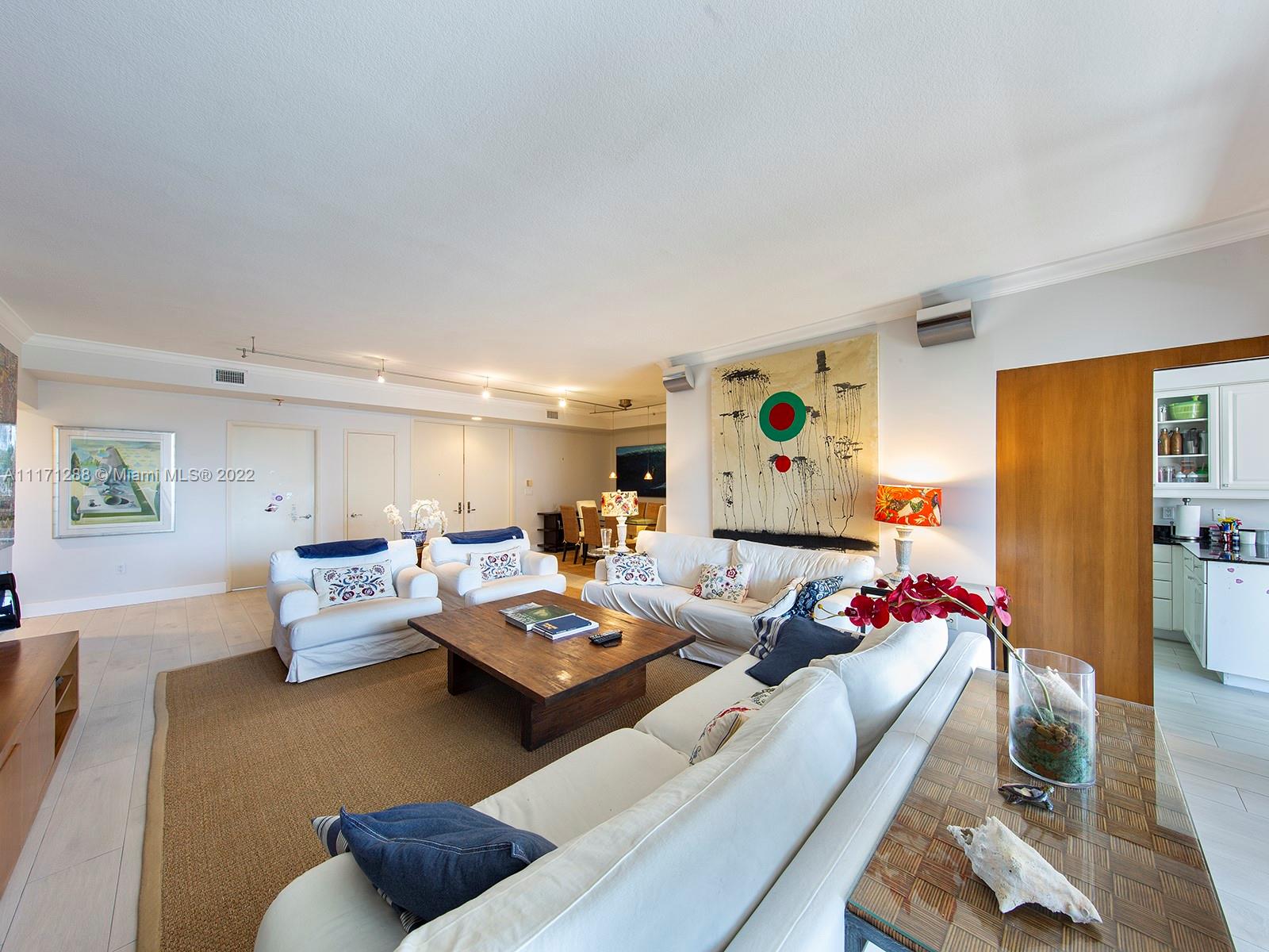 735 Crandon Boulevard, Unit 503 Key Biscayne, FL 33149 - Photo 5 of 18 a living room with furniture and a couch