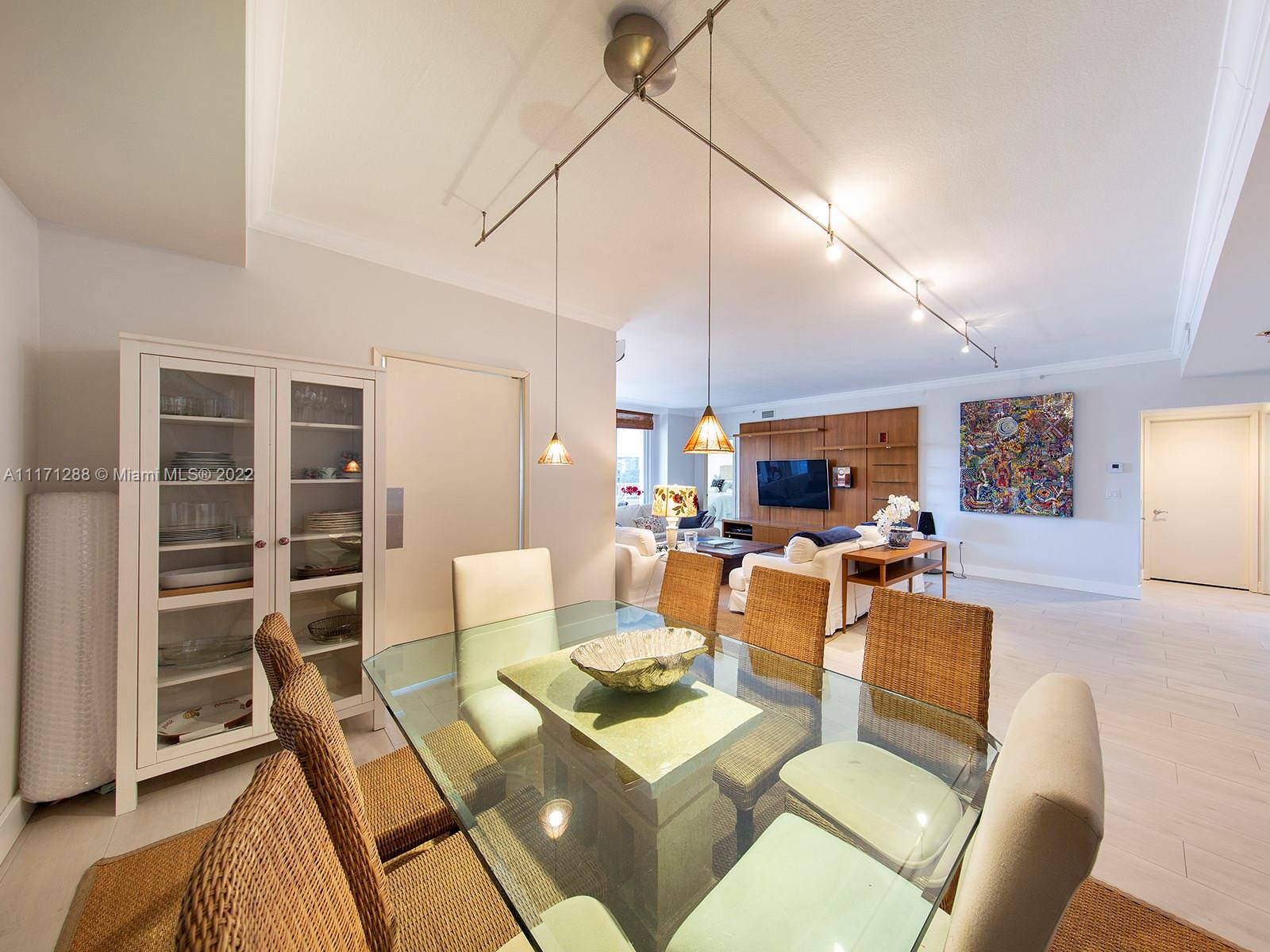 735 Crandon Boulevard, Unit 503 Key Biscayne, FL 33149 - Photo 6 of 18 a living room with furniture and a wooden floor