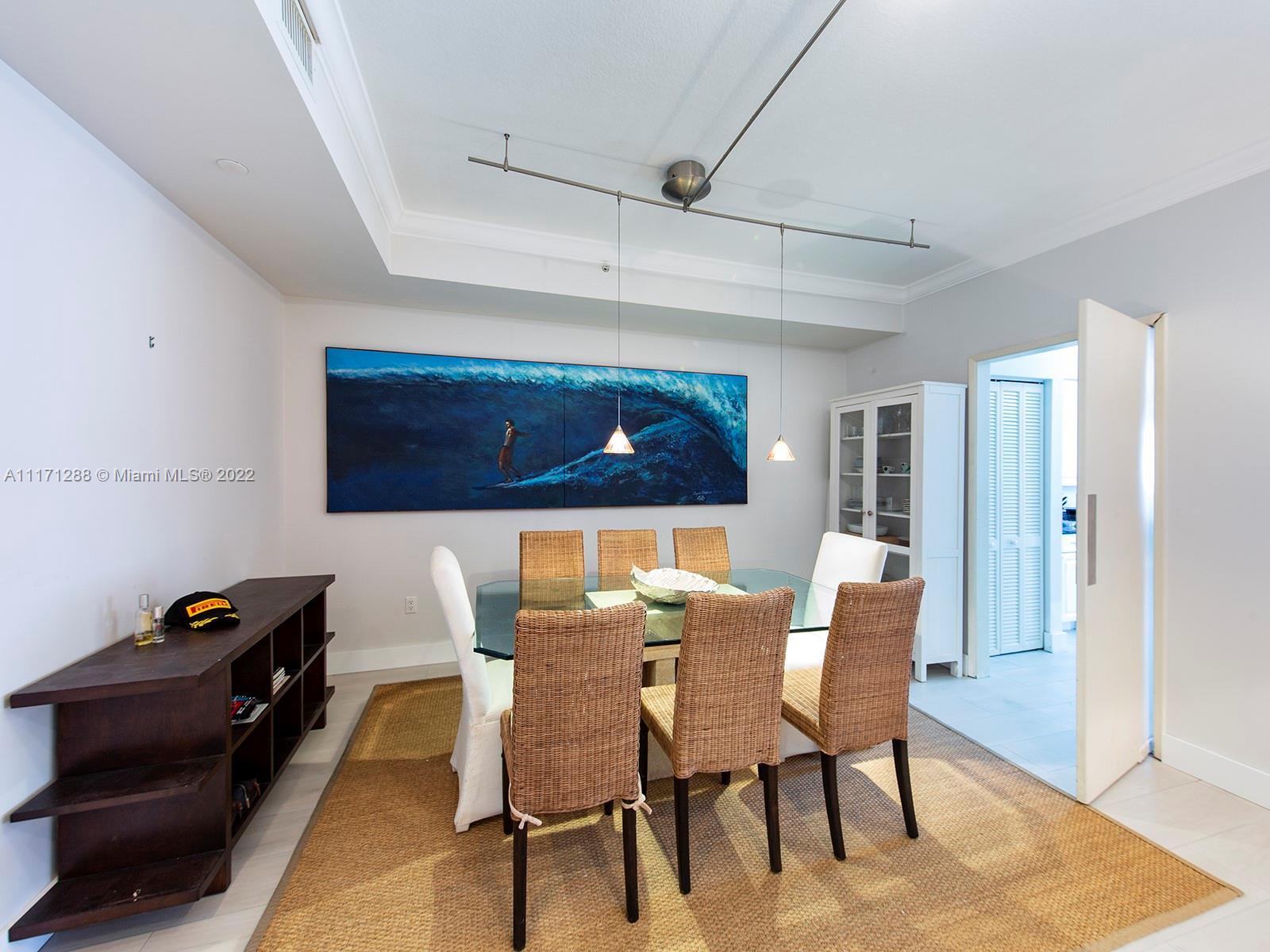 735 Crandon Boulevard, Unit 503 Key Biscayne, FL 33149 - Photo 7 of 18 a dining room with furniture and wooden floor