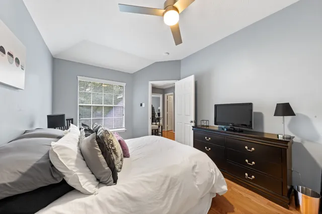 a bedroom with a bed and a flat screen tv