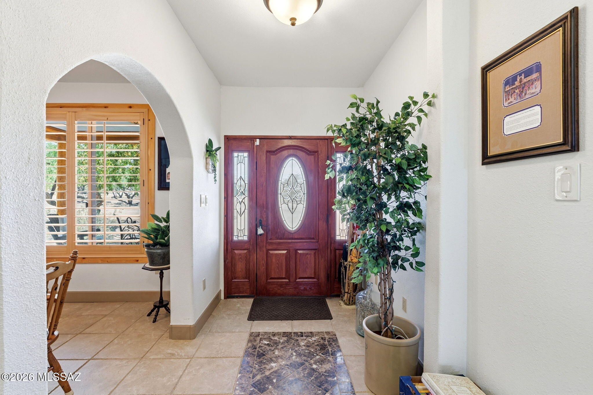 12810 West Gunsmoke Road Tucson, AZ 85736 - Photo 6 of 51 a view of entryway with paintings on the wall