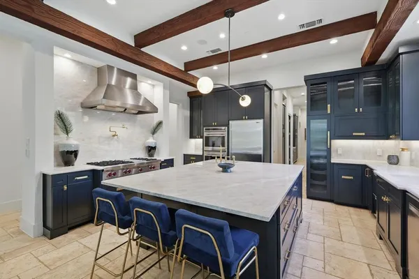 a kitchen with a table and chairs in it