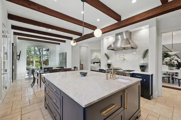 a kitchen with stainless steel appliances granite countertop a sink and cabinets