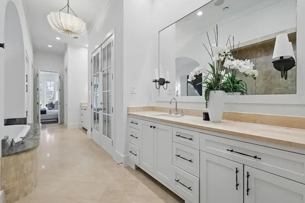 a bathroom with a double vanity sink and a mirror