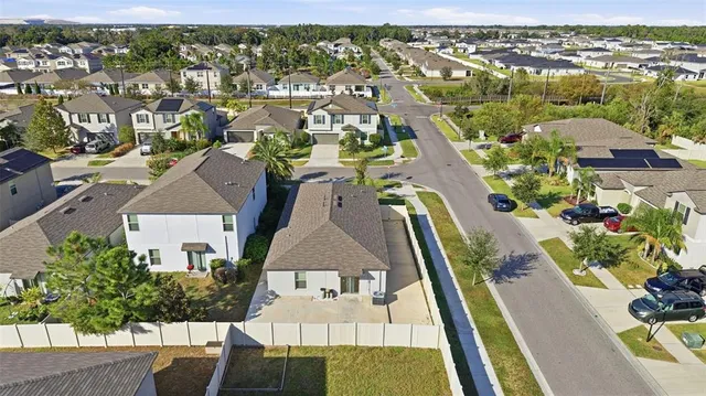 an aerial view of residential houses with outdoor space