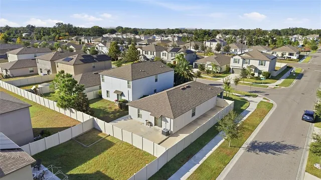 an aerial view of a house with a garden