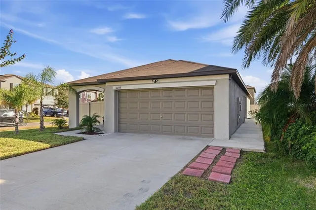 a front view of a house with a yard