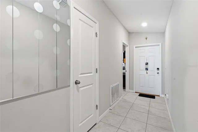 a view of a hallway with closet area