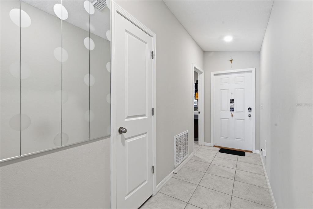 10239 Bright Crystal Avenue Riverview, FL 33578 - Photo 22 of 47 a view of a hallway with closet area