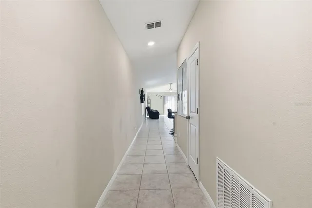 a view of a hallway with a white walls