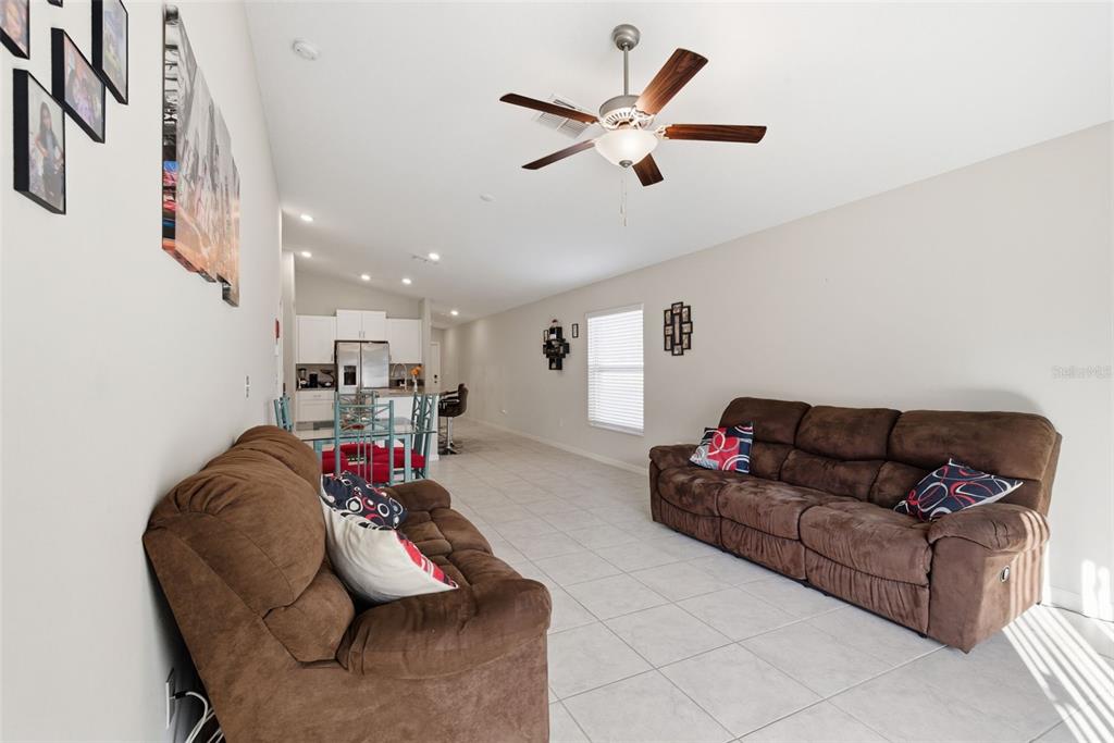 10239 Bright Crystal Avenue Riverview, FL 33578 - Photo 28 of 47 a living room with furniture and a flat screen tv