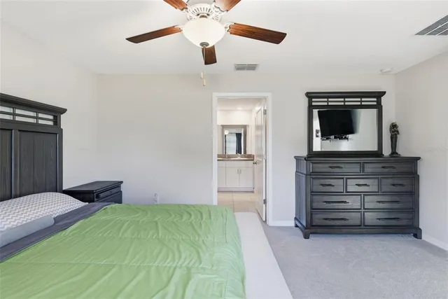 a bedroom with a bed and a tv