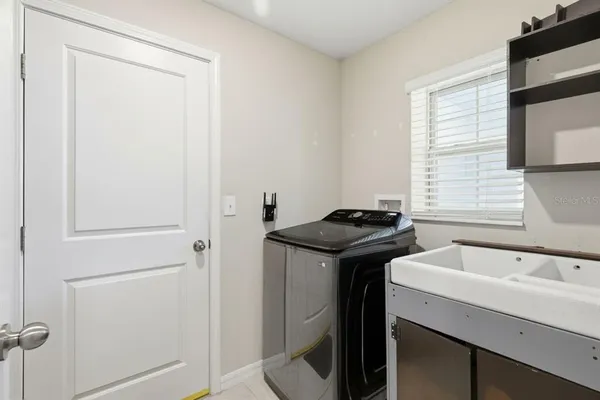 a view of a sink and a window in a room