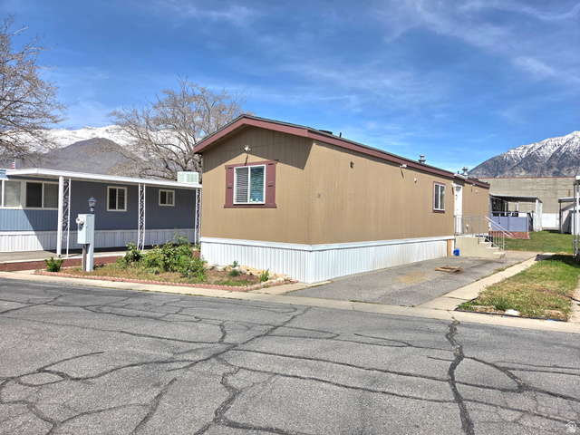 597 North State Street, Unit 67 Orem, UT 84057 - Photo 3 of 23 View of home's exterior featuring a mountain view and covered porch