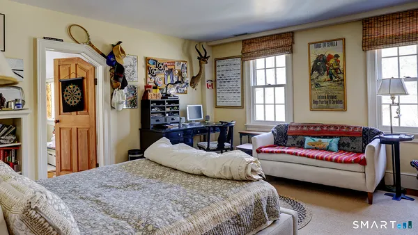 a bedroom with bed and window