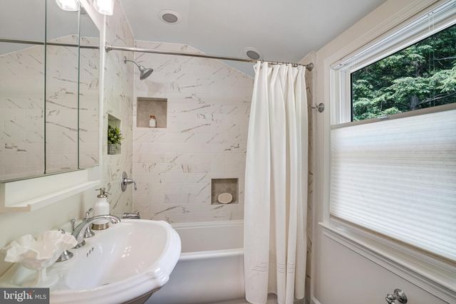 a bathroom with a sink and a shower