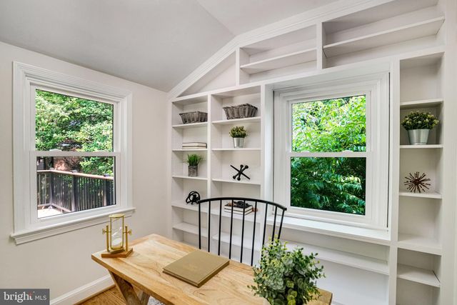 a view of a balcony with wooden floor and outdoor space