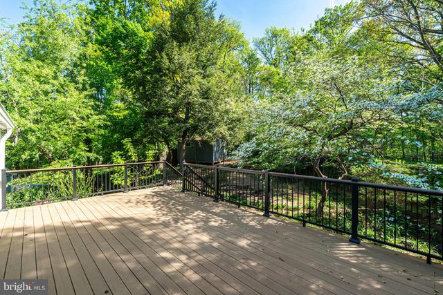 a view of a balcony with wooden floor